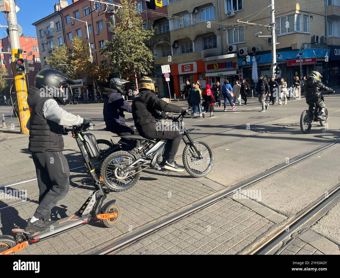 Young bikers riding mopeds in Sofia Bulgaria, Eastern Europe, Balkans, EU - Smartphone Captured Stock Image