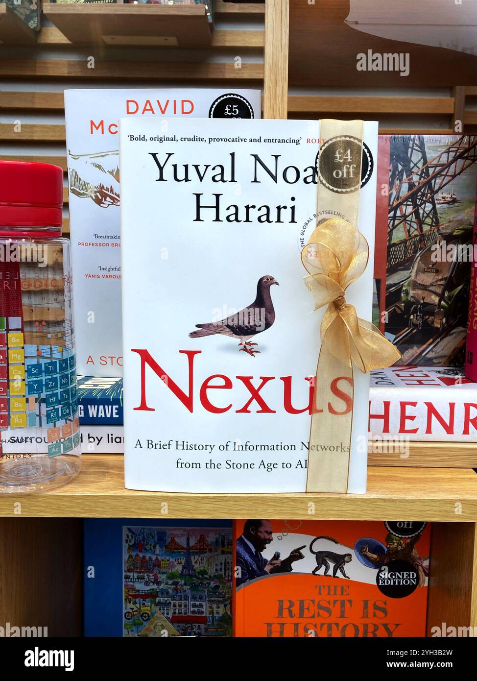 Israeli author Yuval Noah Harari, Nexus: A Brief History of Information Networks from the Stone Age to AI,  in a book shop window - Smartphone Captured Stock Image