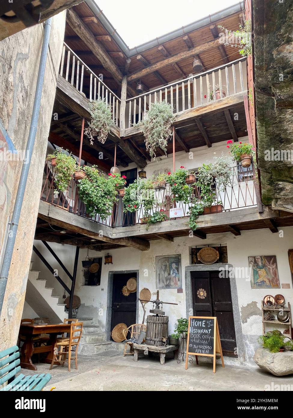 Charming Rustic Courtyard of Cozy Italian Home Restaurant - Smartphone Captured Stock Image