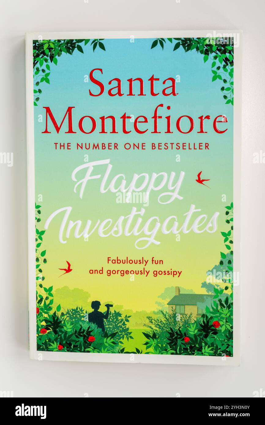 Close up of the cover of a paperback book titled "Flappy Investigates" by Santa Montefiore. "Fabulously fun and gorgeously gossipy" is visible Stock Photo