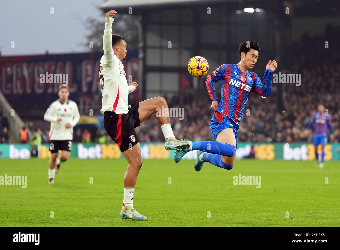 Fulham's Antonee Robinson (left) and Crystal Palace's Daichi Kamada during the Premier League match at Selhurst Park, London. Picture date: Saturday November 9, 2024. Stock Photo