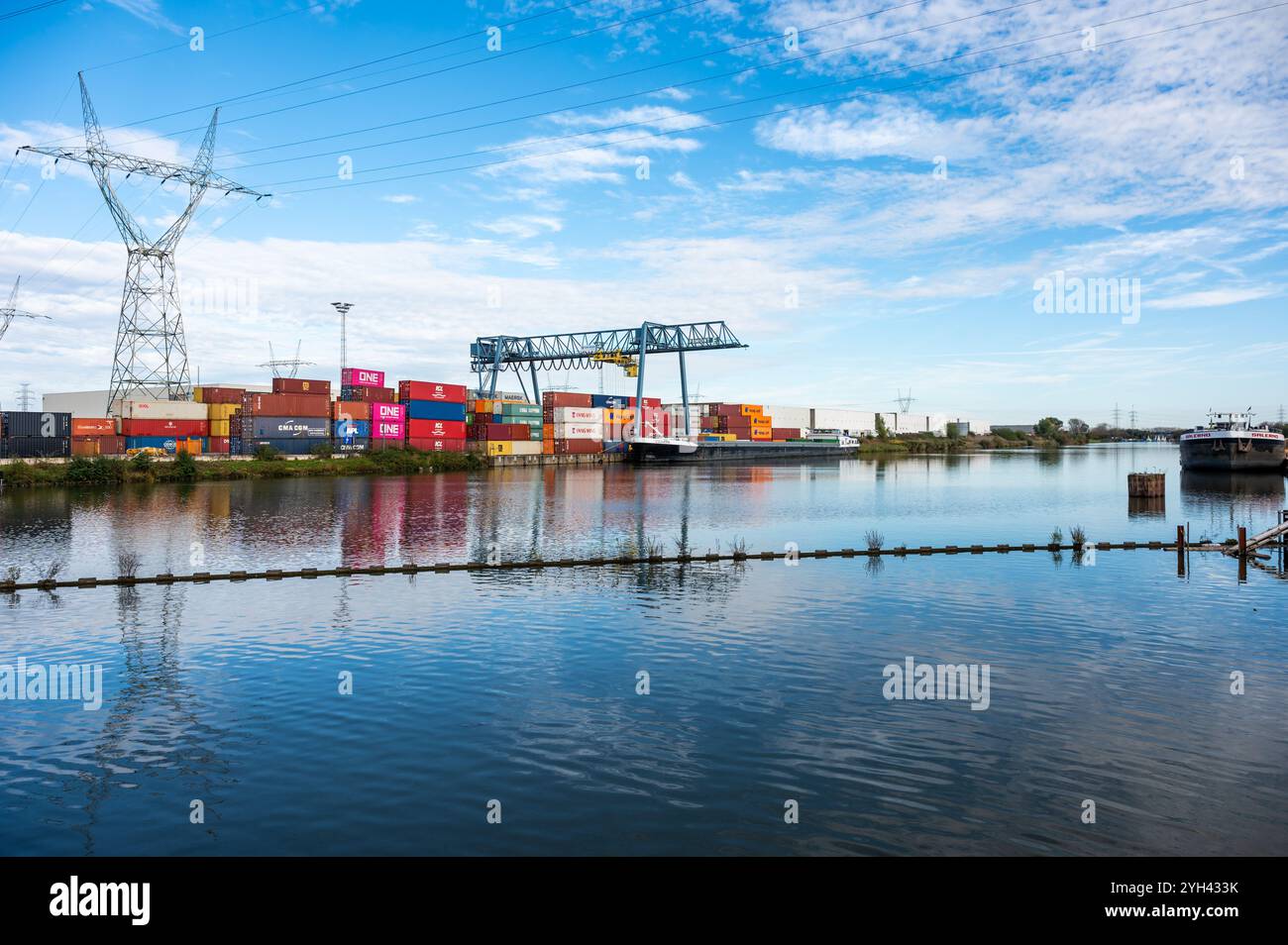 Industrial cranes and container at a logistic dock and loading center ...