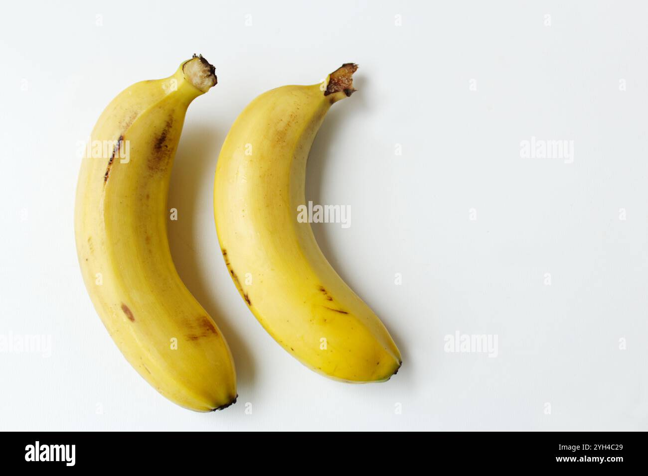 Photo inspiration: Visual Reference: Two Bananas On White Background With Copy Space Healthy Organic