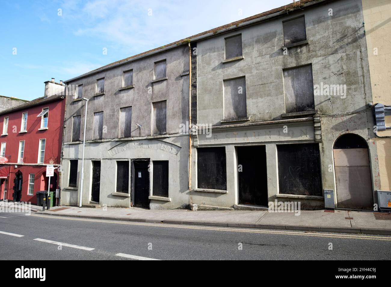 old abandoned shopfronts and townhouses on bridge street ballinrobe, county mayo, republic of ireland Stock Photo