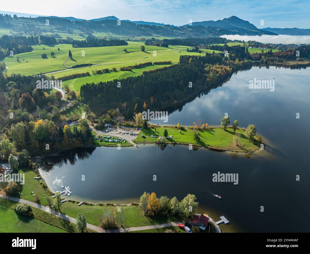 Sports facility and bathing area, lake Rottachsee, at village Petersthal,  mt. Gruenten in the back, autumn, aerial view, Allgaeu, Bavaria, Germany Stock Photo