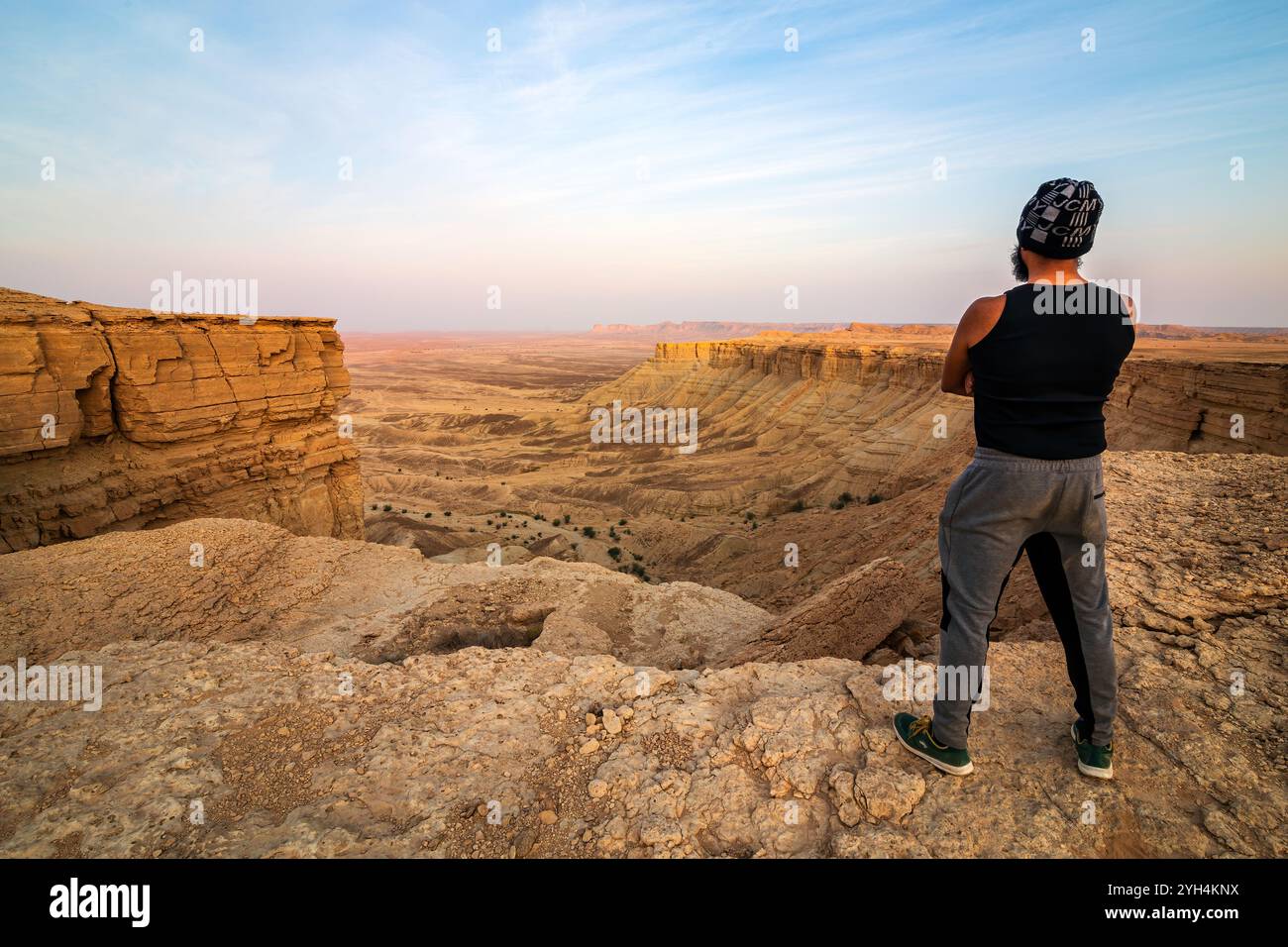An adventure traveller in Edge of the World, a natural landmark and popular tourist destination near Riyadh -Saudi Arabia. Stock Photo