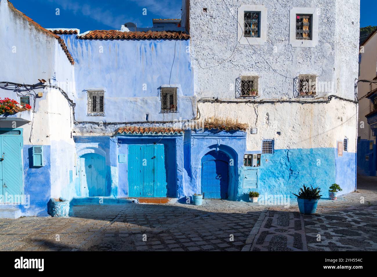 Blue colored houses and streets in Chefchaouen, Morocco.  Chefchaouen is a small city in the Rif Mountains and is often referred to as the “blue city” Stock Photo