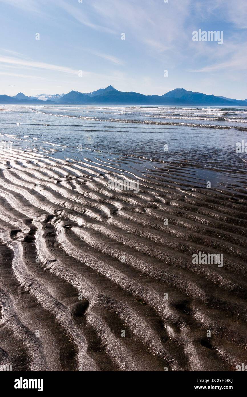 A minus tide exposing sandy ridges on the shores of the Homer Spit