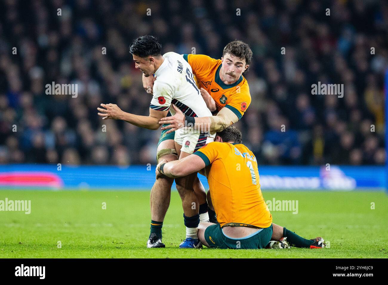 Marcus Smith of England under pressure from Angus Bell of Australia ...