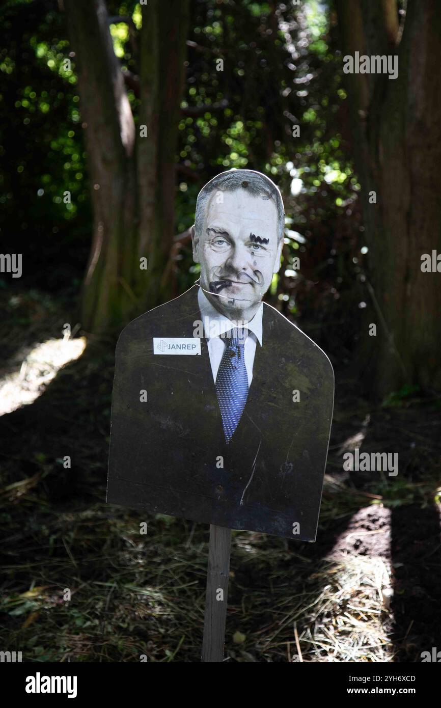 Defaced Jan Vapaavuori cardboard cutout as a scarecrow at Lapinlahti allotment garden in Helsinki, Finland Stock Photo