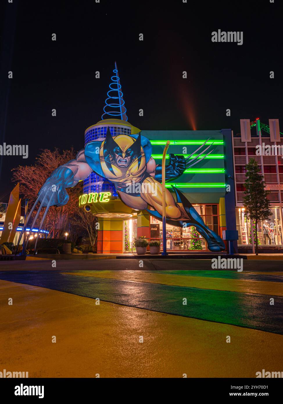 Thrilling Theme Park Ride Illuminated at Night Stock Photo