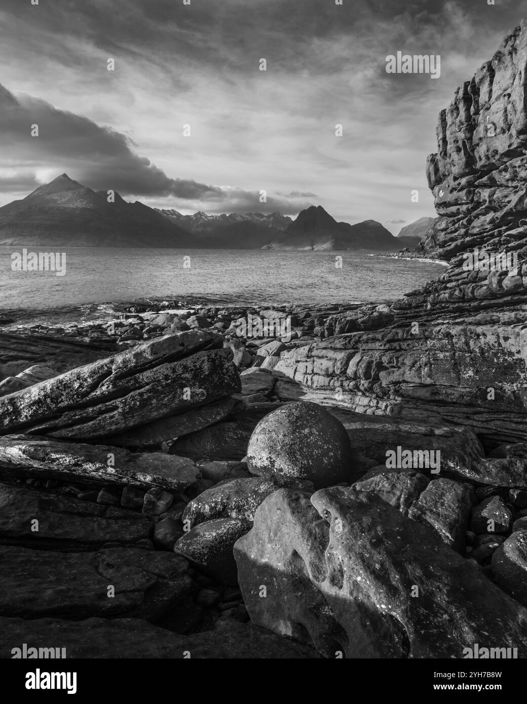 Elgol Dramatic Rocky Shoreline with Mountain View in Black and White Stock Photo