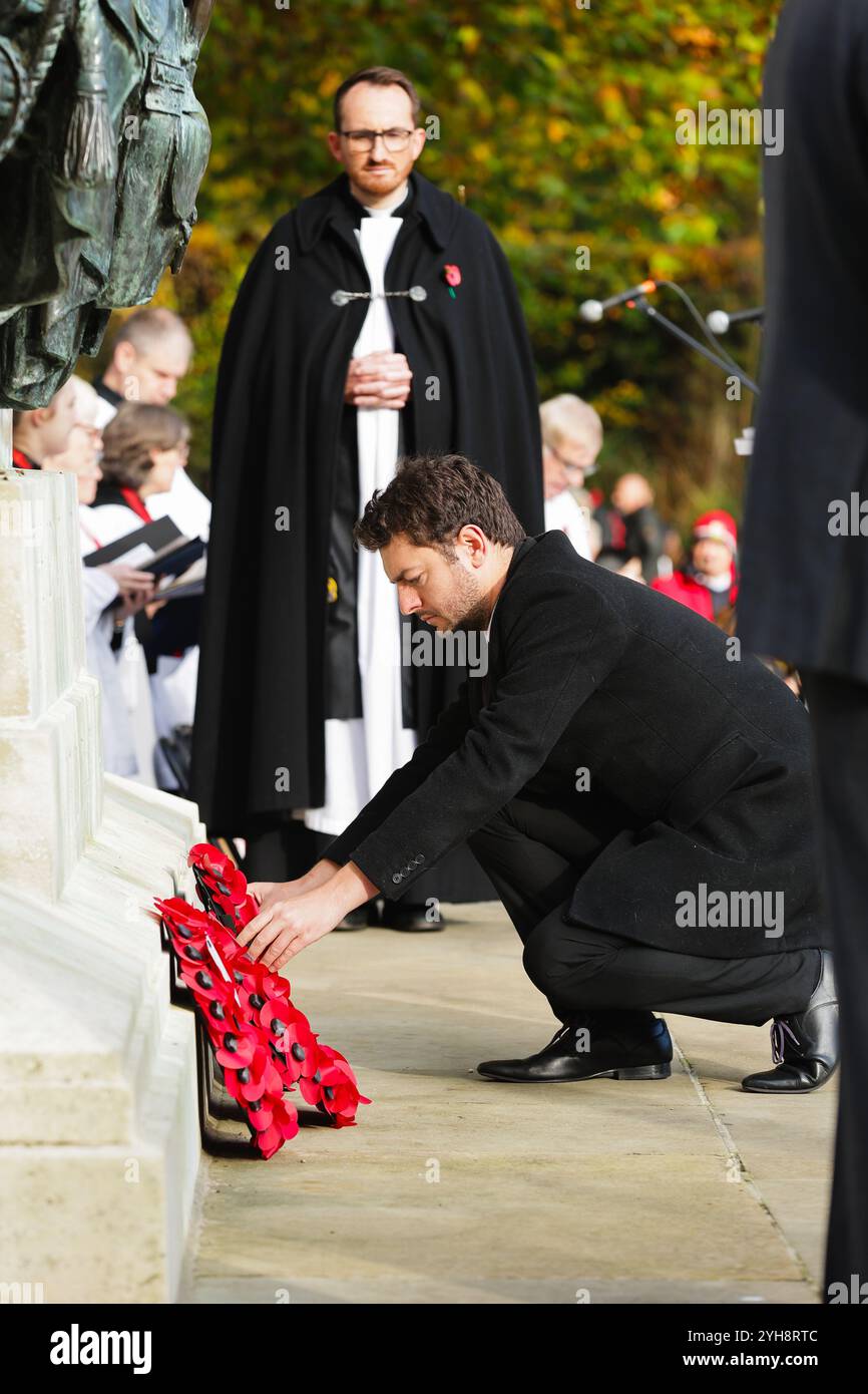 Ipswich MP Jack Abbott lays a poppy wreath at Remembrance Sunday, Christchurch Park War Memorial, Ipswich. Stock Photo