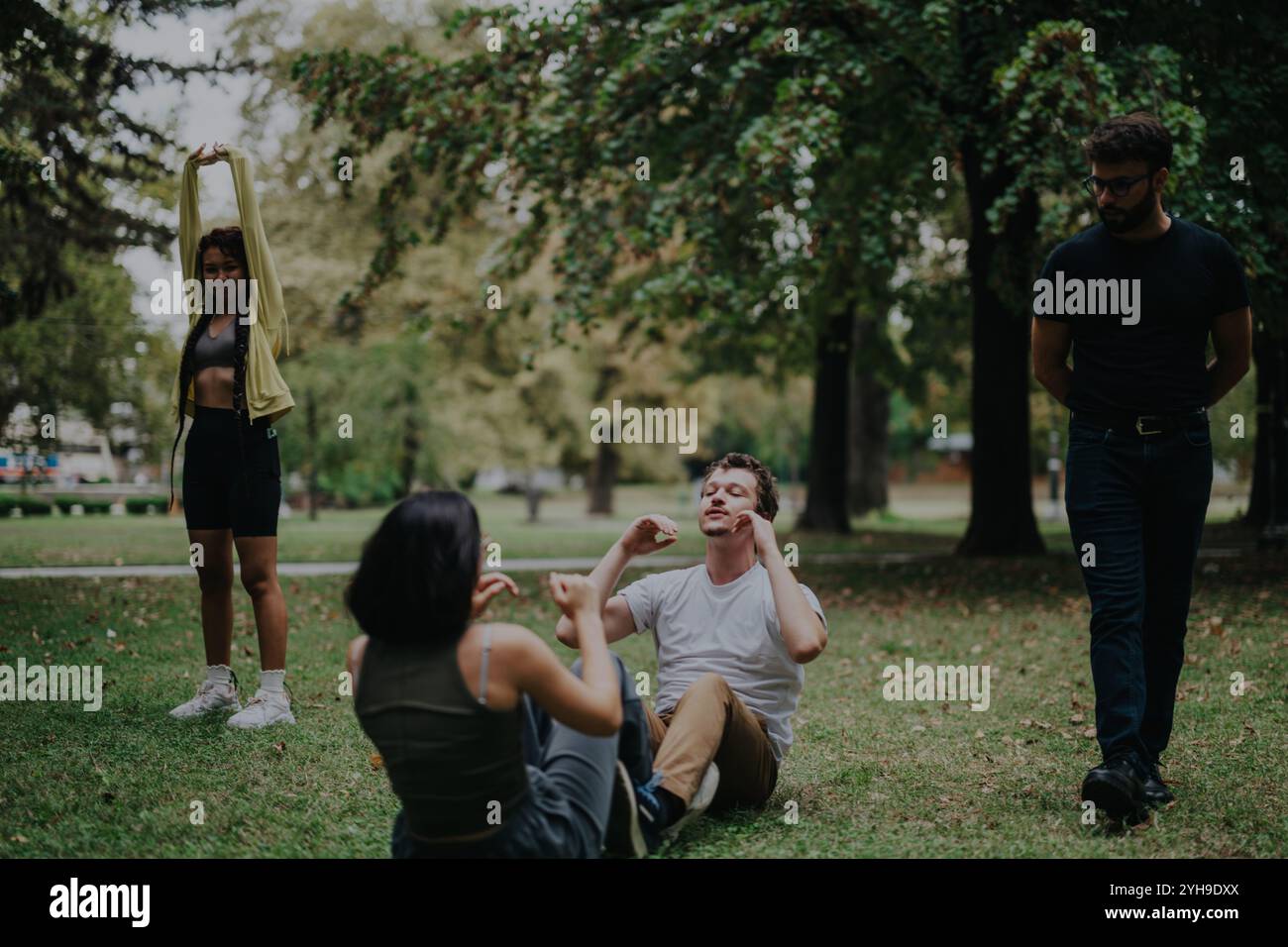 Group of young students participating in outdoor exercise class Stock ...