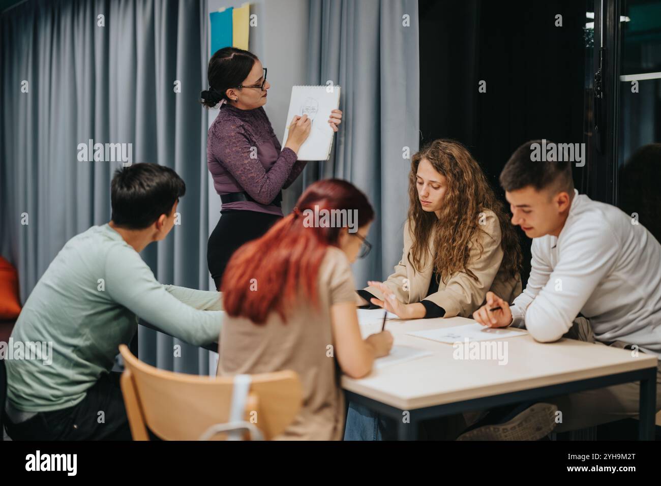Students participating in an engaging classroom learning session Stock ...