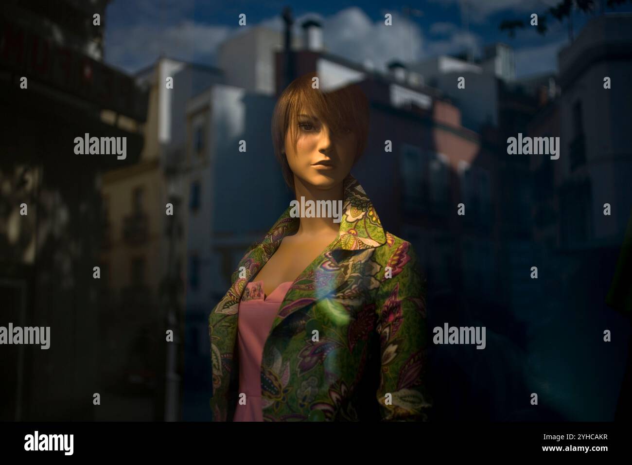 A mannequin decorates a shopwindow in Seville. Stock Photo