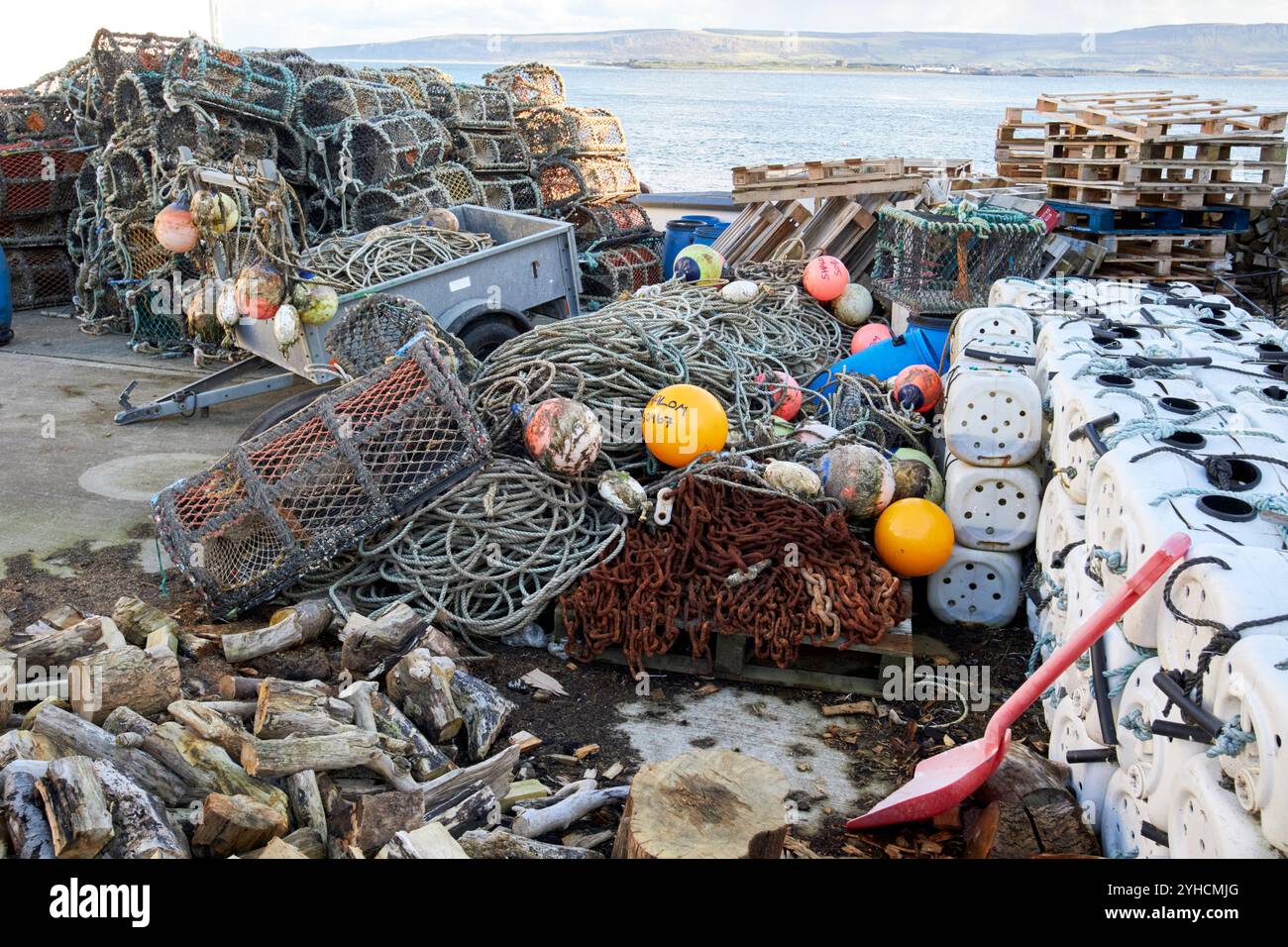 piles of lobster pots, home made floats, ropes and other fishing boat equipment inishowen, county donegal, republic of ireland Stock Photo