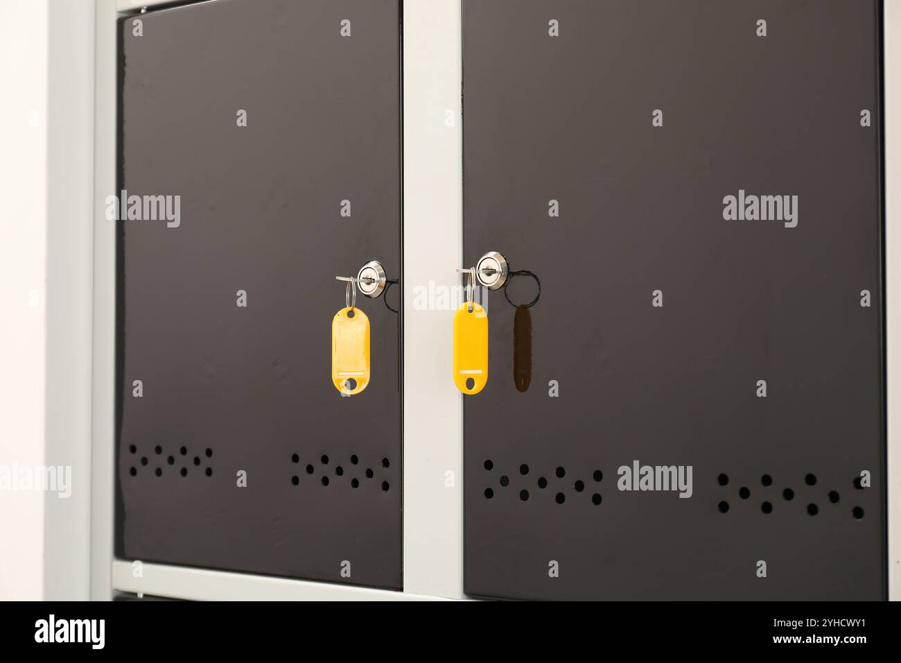 Modern lockers with bright keys, closeup view Stock Photo