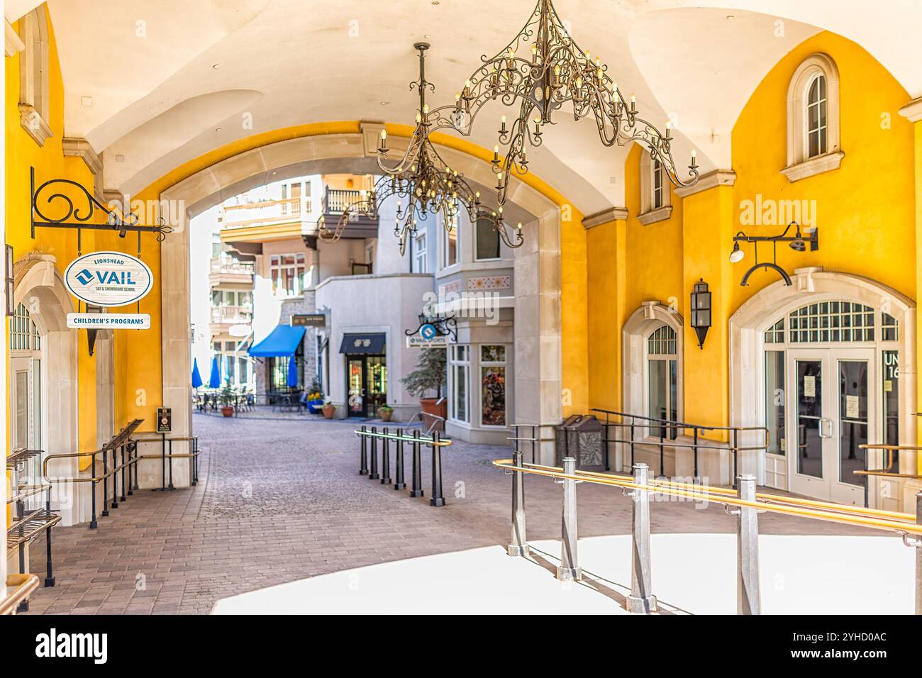 Vail, USA - July 11, 2022: Arched Pathway with railing to the shopping area at Lionshead Place Arabelle hotel in Vail, Colorado Stock Photo