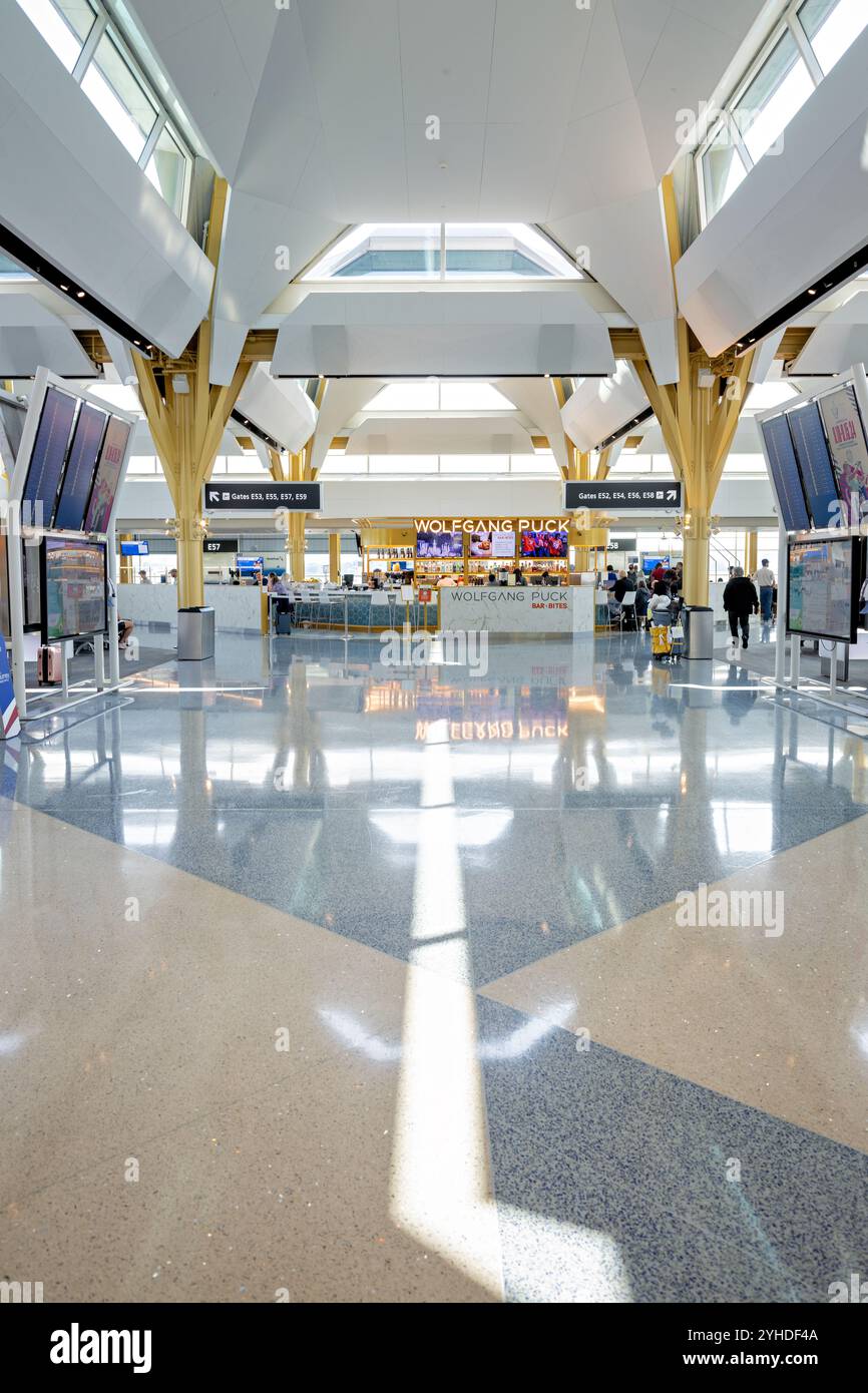 Ronald Reagan Washington National Airport Concourse Arlington Virginia // ARLINGTON, Virginia — The new 14-gate concourse at Ronald Reagan Washington National Airport replaces the former Gate 35X with a modern 225,000-square-foot facility. Part of Project Journey, this American Airlines regional terminal features contemporary passenger amenities, permanent jetbridges, and expansive windows offering views of the Washington, D.C. skyline. Stock Photo