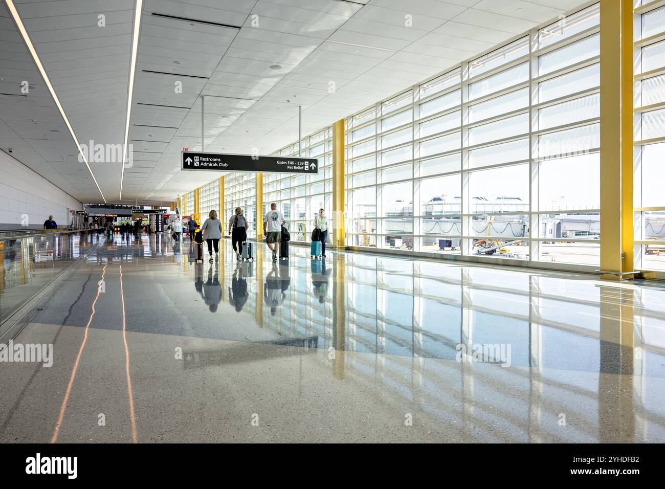 Ronald Reagan Airport New Concourse Arlington Virginia // ARLINGTON, Virginia — The new 14-gate concourse at Ronald Reagan Washington National Airport replaces the former Gate 35X with a modern 225,000-square-foot facility. Part of Project Journey, this American Airlines regional terminal features contemporary passenger amenities, permanent jetbridges, and expansive windows offering views of the Washington, D.C. skyline. Stock Photo
