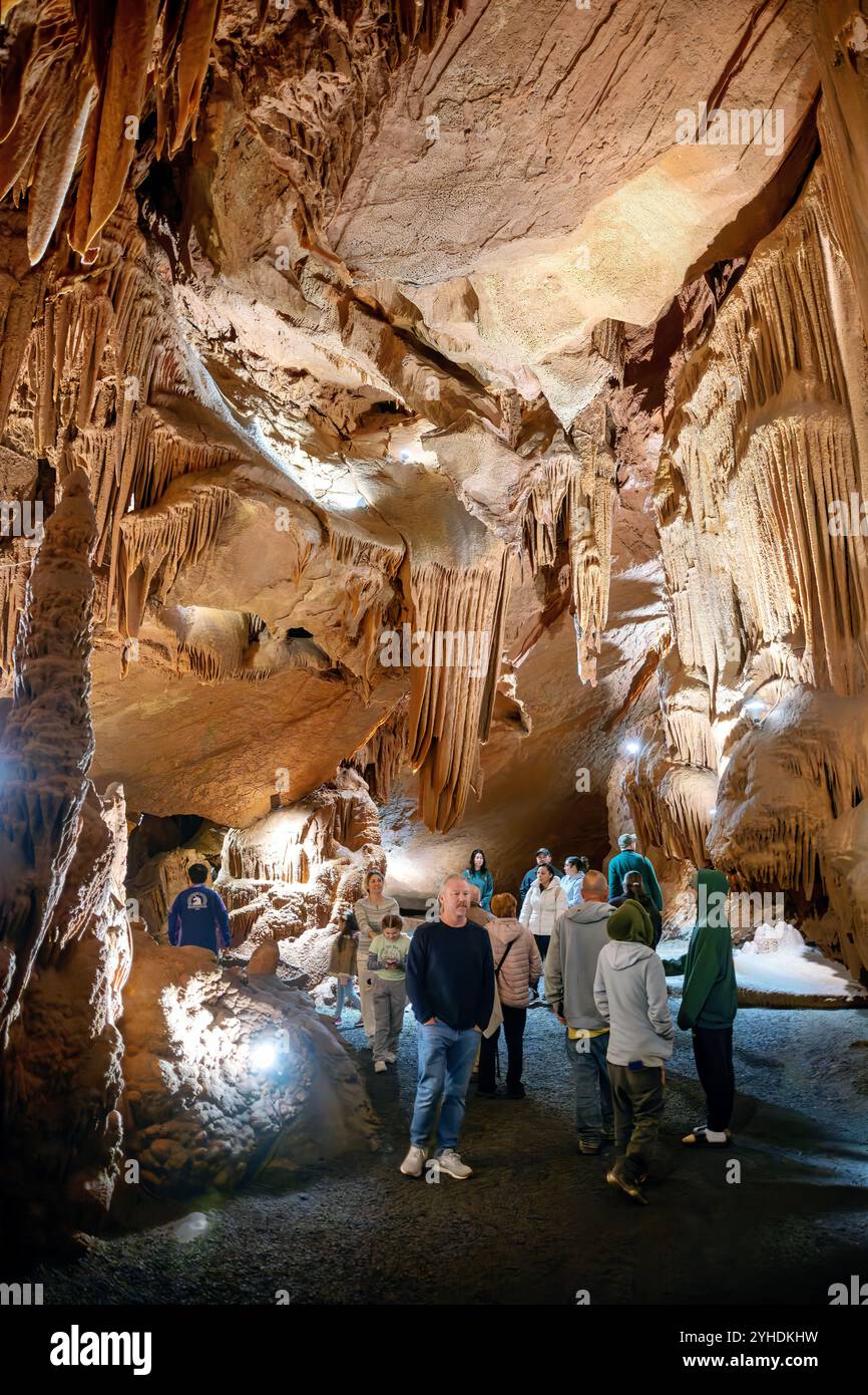 Shenandoah Caverns Cave Formations Quicksburg Virginia // QUICKSBURG, Virginia — Shenandoah Caverns, discovered in 1884 during railroad quarrying operations on Abraham Neff's property, features extensive limestone cave formations accessible by elevator. The caverns, developed for tourism in 1922 by Hunter Chapman, remain the only show cave in Virginia with elevator access. The cave system showcases natural formations including stalactites, stalagmites, and flowstone throughout its developed passageways. Stock Photo