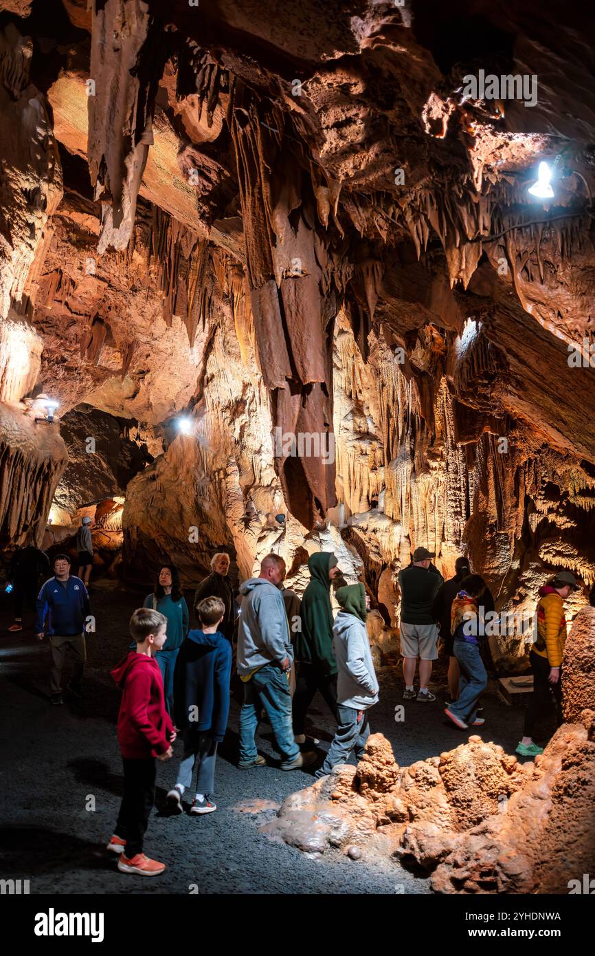 Shenandoah Caverns Cave Formations Quicksburg Virginia // QUICKSBURG, Virginia — Shenandoah Caverns, discovered in 1884 during railroad quarrying operations on Abraham Neff's property, features extensive limestone cave formations accessible by elevator. The caverns, developed for tourism in 1922 by Hunter Chapman, remain the only show cave in Virginia with elevator access. The cave system showcases natural formations including stalactites, stalagmites, and flowstone throughout its developed passageways. Stock Photo