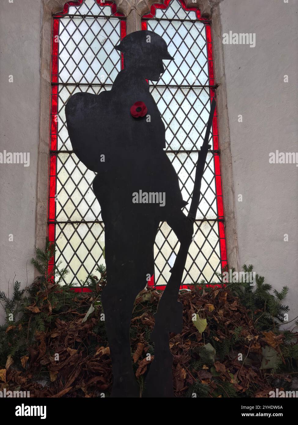 First World War remembrance figure of soldier in church window, Framsden, Suffolk, England, UK - Smartphone Captured Stock Image