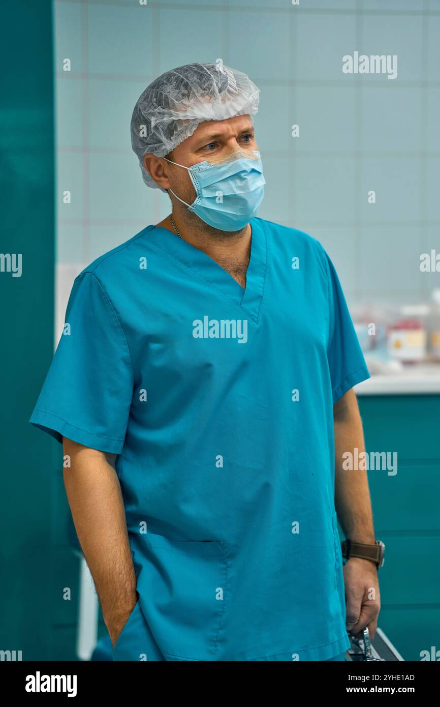 The surgeon is standing in the operating room with a tool Stock Photo ...