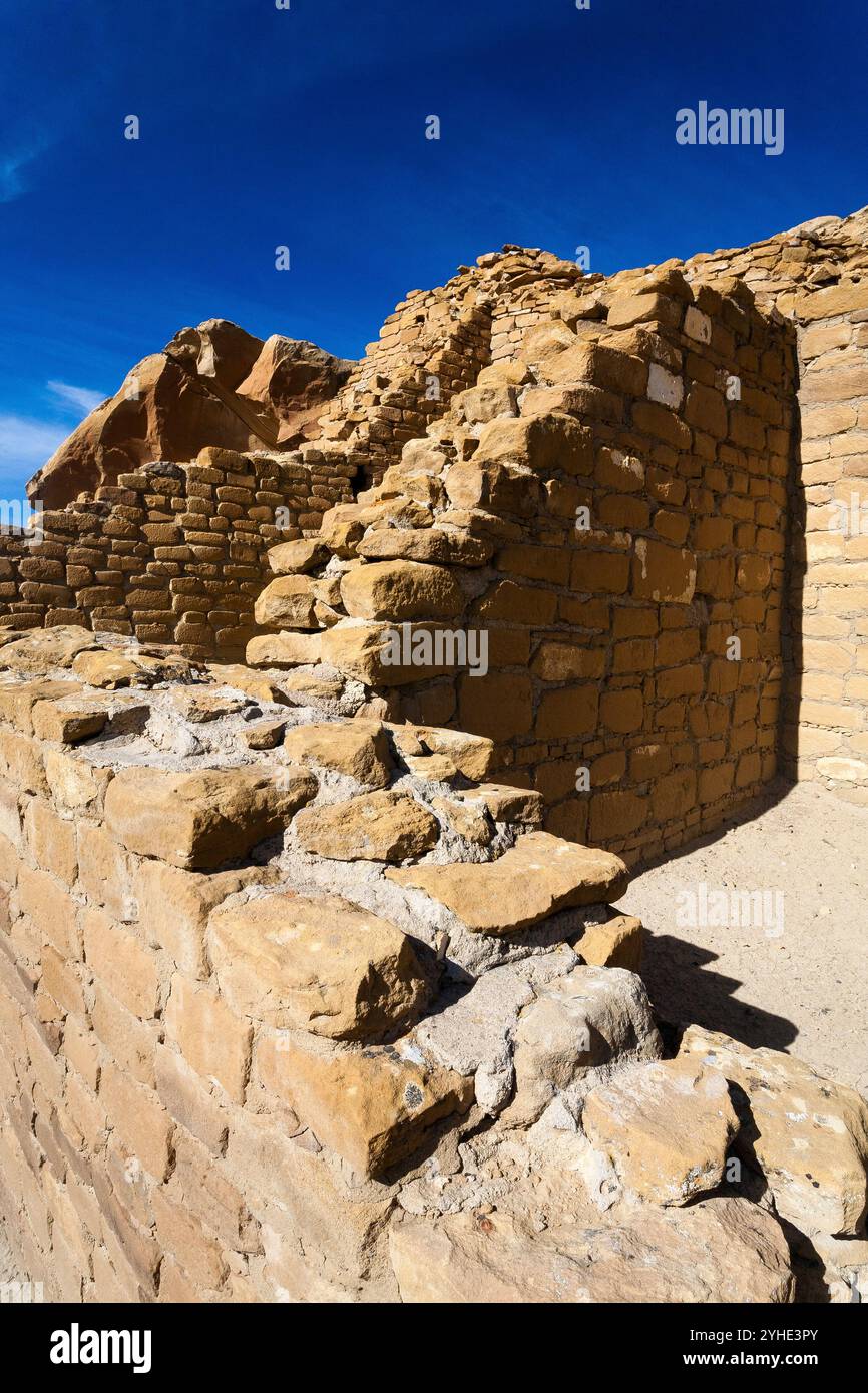 Exposed rooms lined by decaying walls in the Kin Kletso Pueblo. Chaco ...
