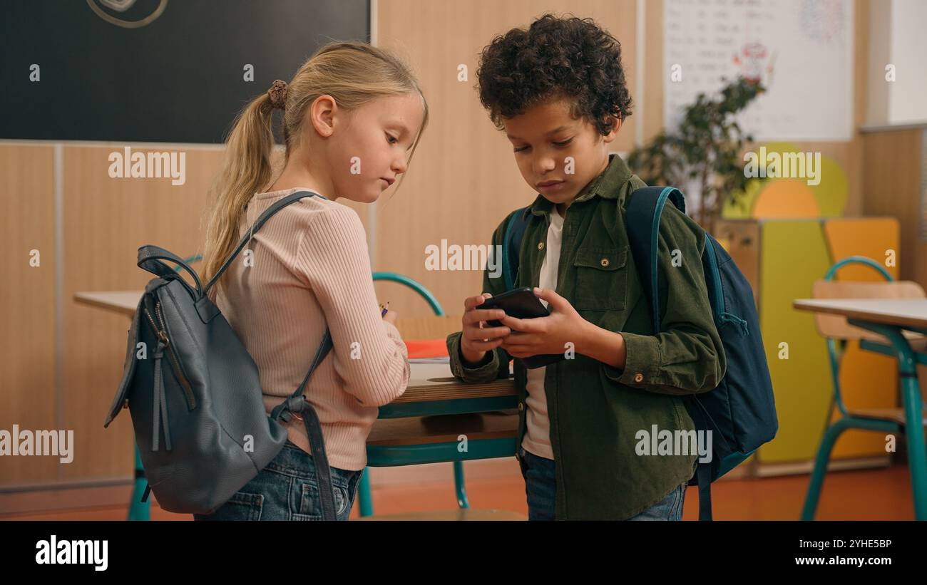 African and Caucasian little elementary school children multiracial