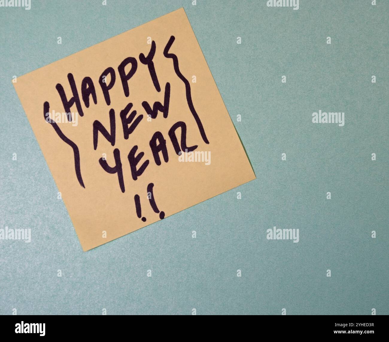 Yellow post it note with Happy New Year Stock Photo