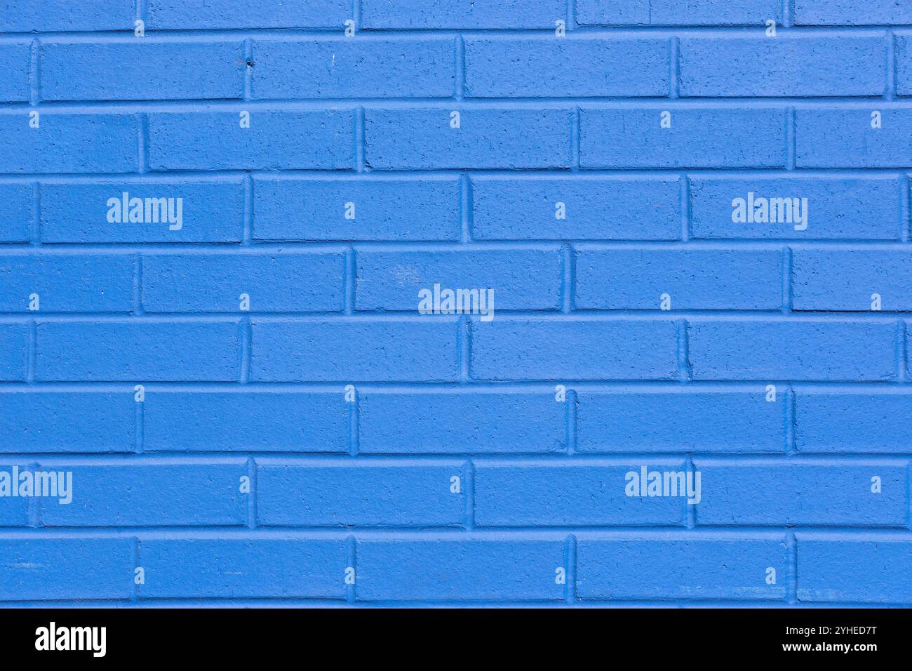 Background from a wall made of blue painted bricks Stock Photo