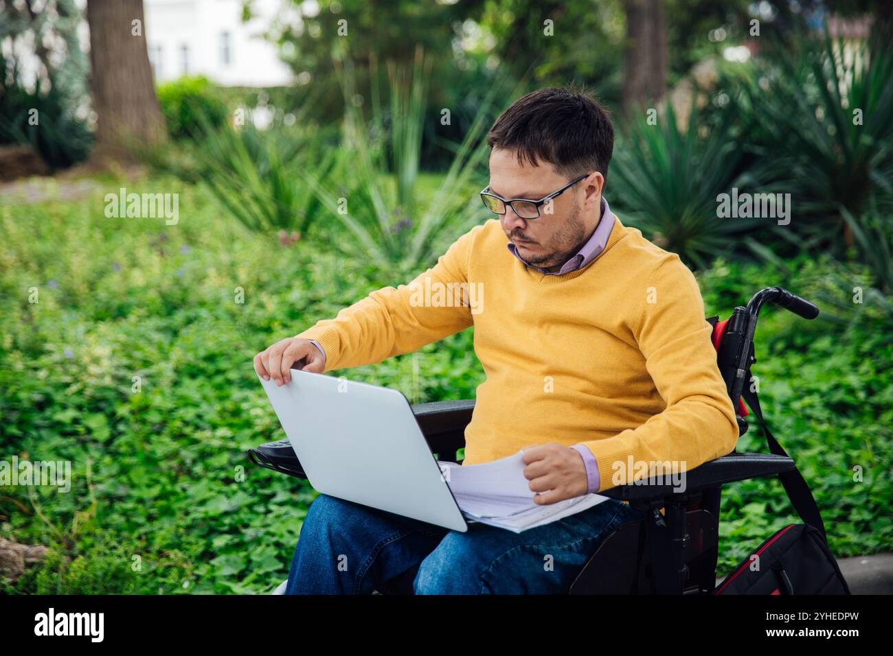 Man Wheelchair Working Learning On Laptop Stock Photo