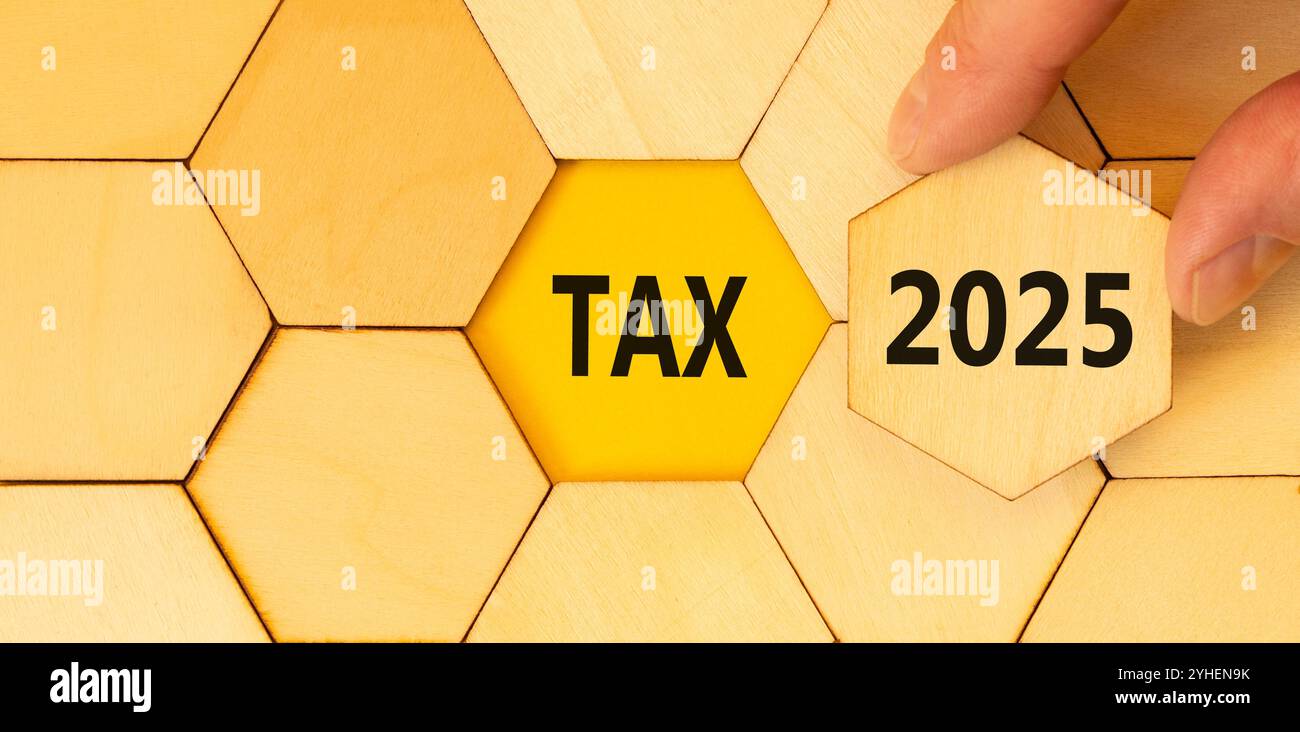 Planning tax 2025 new year symbol. Concept words Tax 2025 on beautiful wooden puzzle. Beautiful