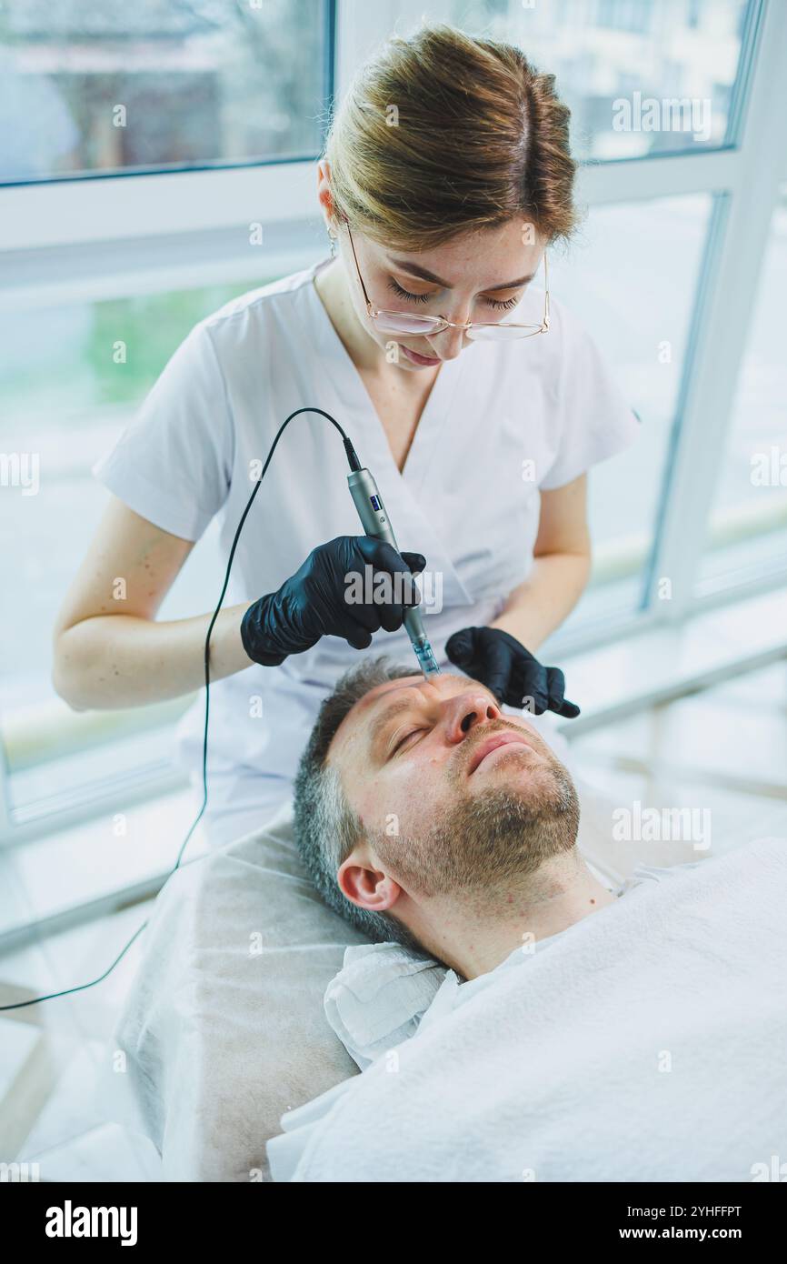 Man cosmetic mask makes spa hi-res stock photography and images - Alamy
