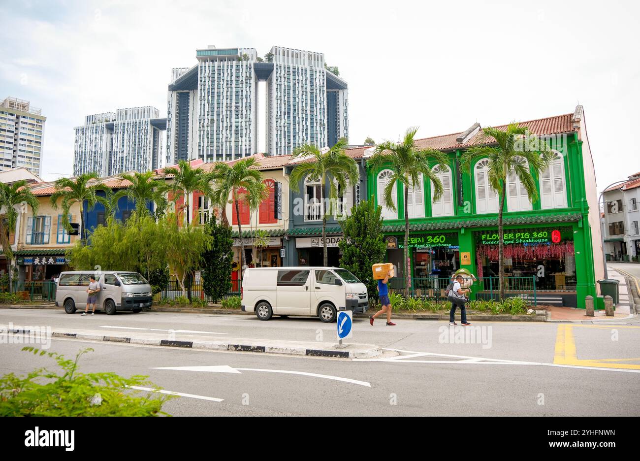 The Pinnacle Duxton residential towers seen in the distance with contrasting Singaporean Chinatown shophouses in the foreground along Tanjong Pagar RD. Stock Photo