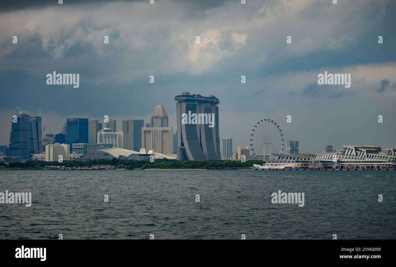 A view of the skyline of Singapore viewed from the Singapore Strait showing Marina Bay Sands, Singapore Flyer and city skyscrapers. Stock Photo
