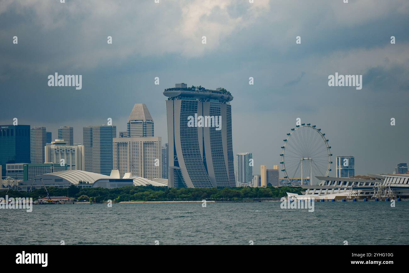 A view of the skyline of Singapore viewed from the Singapore Strait showing Marina Bay Sands, Singapore Flyer and city skyscrapers. Stock Photo