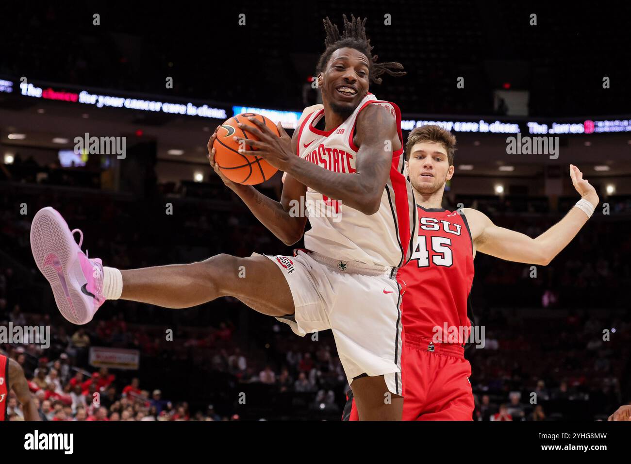 Columbus, Ohio, USA. 11th Nov, 2024. Ohio State Buckeyes forward Aaron Bradshaw (4) brings down a rebound in front of Youngstown State Penguins center Gabe Dynes (45) during the game between the Youngstown State Penguins and the Ohio State Buckeyes at Value City Arena, Columbus, Ohio. (Credit Image: © Scott Stuart/ZUMA Press Wire) EDITORIAL USAGE ONLY! Not for Commercial USAGE! Stock Photo