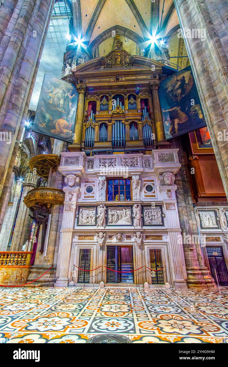 MILAN, ITALY - APRIL 8, 2022: Historic Pipe Organ in Milan Duomo with large paintings on the shutters, on April 8 in Milan, Italy Stock Photo