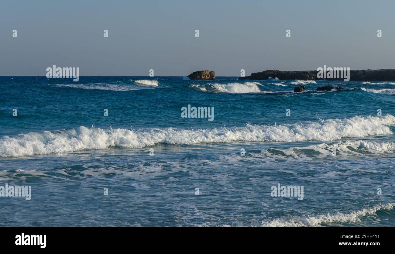 Gentle waves crash on warm hi-res stock photography and images - Alamy