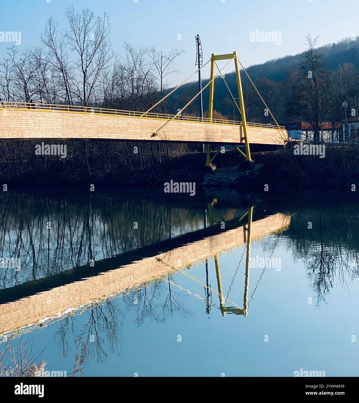 A reflection of a bridge in water or river - Smartphone Captured Stock Image