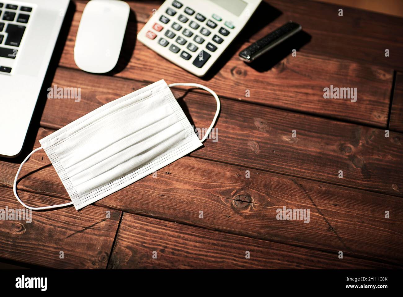 Mask, computer and calculator Stock Photo - Alamy