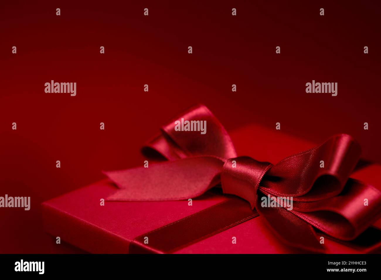 Gift box with red ribbon Stock Photo - Alamy