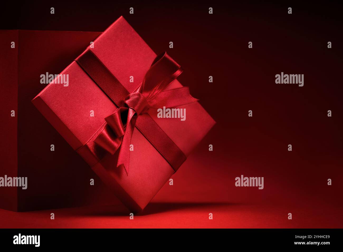 Gift box with red ribbon Stock Photo - Alamy