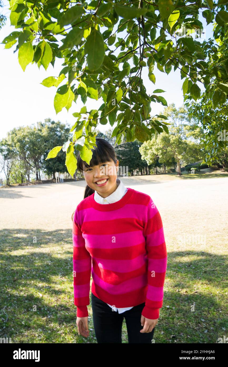 Woman wearing green jumper hi-res stock photography and images - Alamy