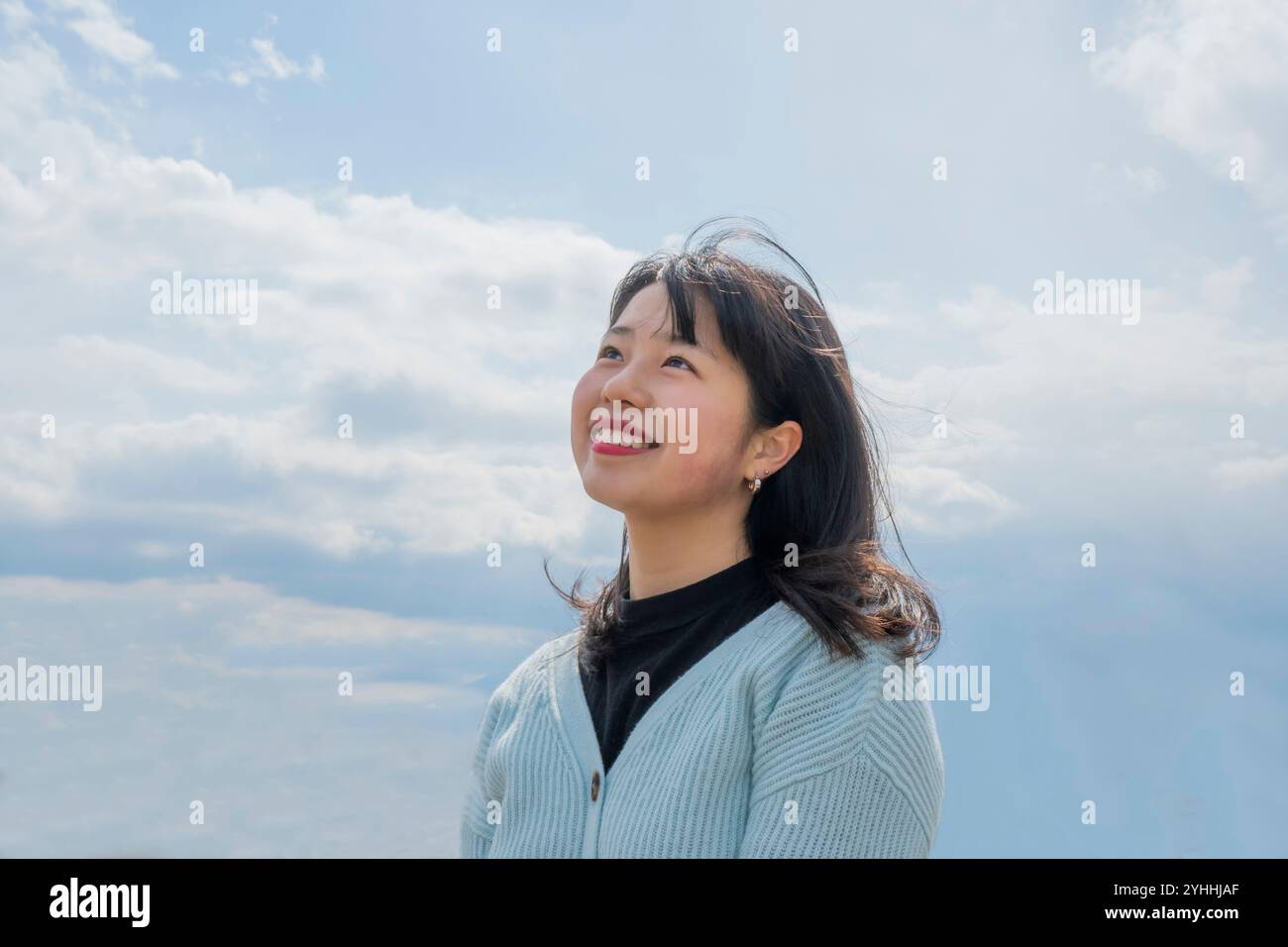 Woman looking up at sky hi-res stock photography and images - Alamy