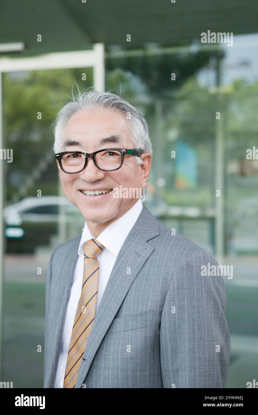Middle aged businessman standing in hi-res stock photography and images ...