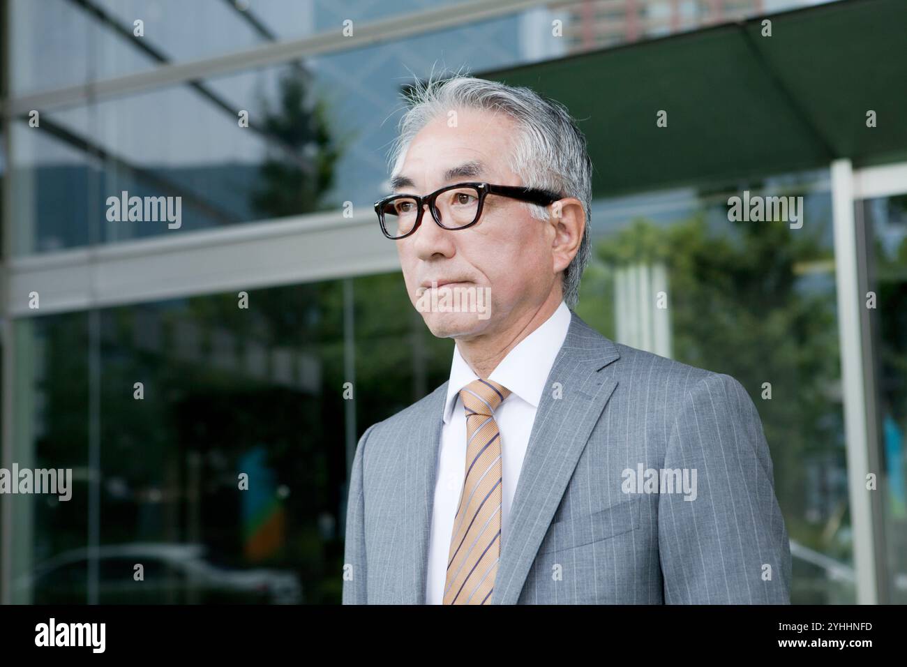 Middle aged businessman standing in hi-res stock photography and images ...